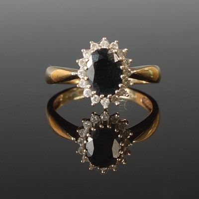 Lot 66 - A 9ct gold sapphire and diamond cluster ring,...