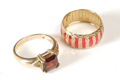 Lot 68 - A 9ct gold garnet and diamond chip dress ring,...