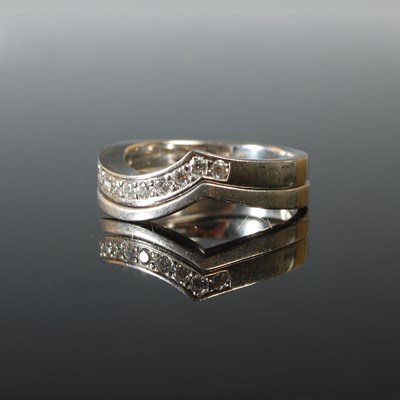 Lot 71 - A 950 grade platinum and diamond half hoop...