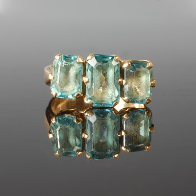 Lot 75 - An 18ct gold zircon three stone ring, set with...
