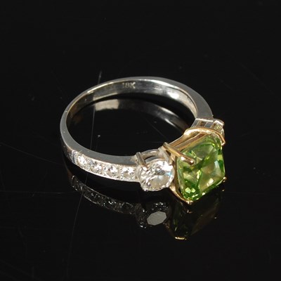 Lot 82 - An 18ct white gold enhanced green diamond and...