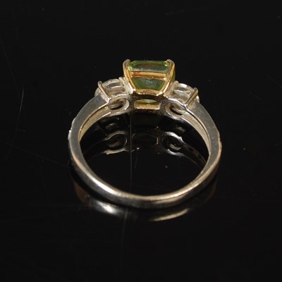Lot 82 - An 18ct white gold enhanced green diamond and...