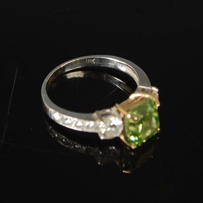 Lot 82 - An 18ct white gold enhanced green diamond and...