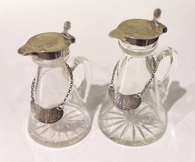 Lot 124 - Two silver mounted clear glass whisky noggins,...