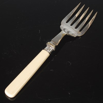 Lot 131 - A silver plated serving fork, the ivorine...