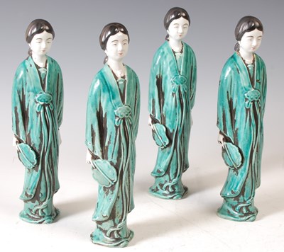 Lot 143 - A group of four porcelain ladies, probably...
