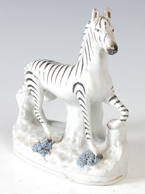 Lot 150 - A 19th century Staffordshire pottery figure...