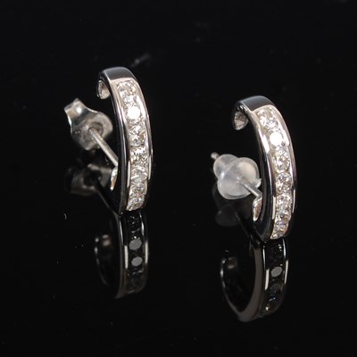 Lot 162C - A pair of 18ct white gold and diamond hoop...