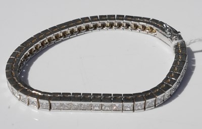 Lot 192 - A white metal diamond set line bracelet, tests...
