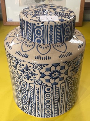 Lot 313 - A decorative pottery jar and cover, decorated...