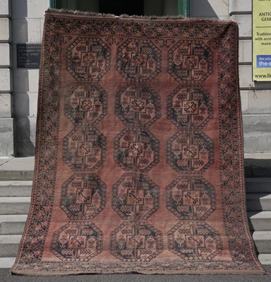 Lot 668 - A Tekke carpet, the rectangular abrashed...