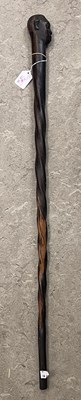 Lot 251B - An African darkwood walking stick, the handle...