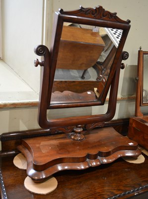 Lot 605 - A 19th century mahogany swing mirror, raised...