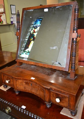 Lot 624 - A 19th century mahogany swing mirror, the...
