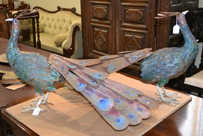 Lot 700 - A pair of 20th century metal peacock...