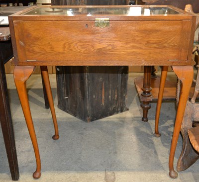 Lot 633 - A 20th century oak display case, the front...