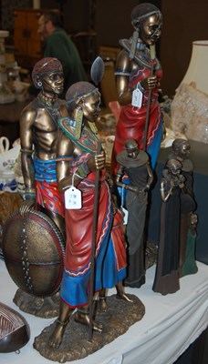 Lot 371 - A group of six decorative African resin figures