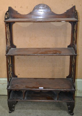 Lot 631 - A 19th century mahogany three tiered shelf,...