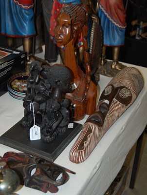 Lot 372 - A group of carved wooden tribal items to...