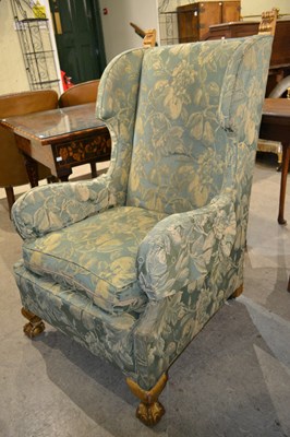 Lot 669 - A late 19th century giltwood wing back...