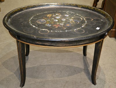 Lot 731 - A 19th century papier mache oval butler table,...
