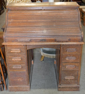 Lot 685 - An early 20th century oak roll top desk, the...