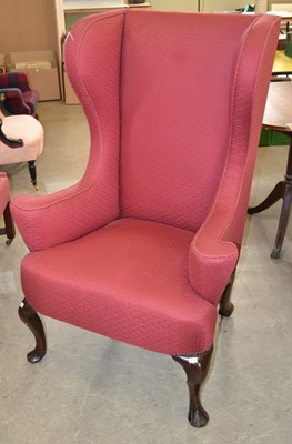 Lot 693 - A 19th century / later wing back armchair,...