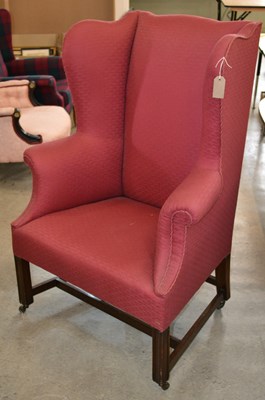 Lot 694 - A 19th century / later wing back armchair,...
