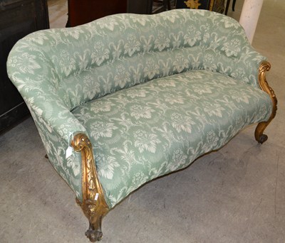 Lot 728 - A 19th century giltwood salon sofa, the front...