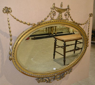 Lot 773 - A Neoclassical style oval mirror in the Adam...