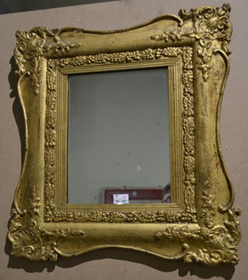 Lot 772 - A small French baroque style gilt wall mirror,...