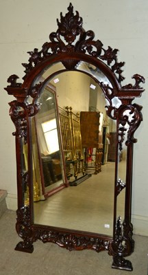 Lot 774 - A decorative wall mirror, with intricate...