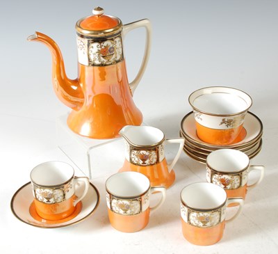 Lot 322 - A Noritake coffee set in orange and white...