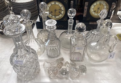 Lot 340 - A collection of cut crystal decanters with...