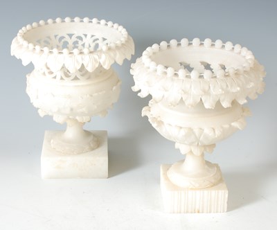 Lot 351 - A pair of carved alabaster urns, with pierced...