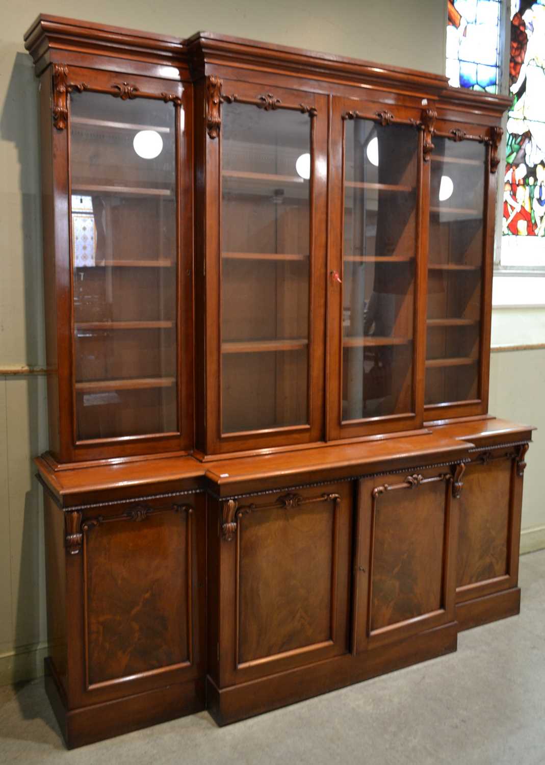 Lot 765 - A 19th century mahogany breakfront bookcase,...