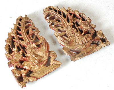 Lot 212 - A pair of Chinese carved wooden panels...