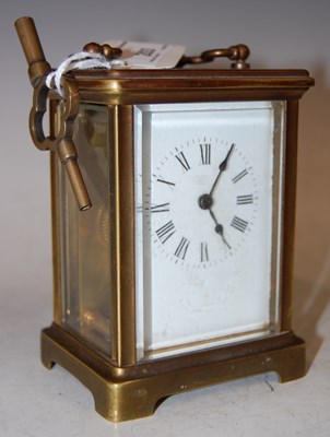 Lot 203 - A brass cased carriage clock with black and...