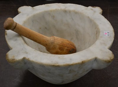 Lot 408 - A carved white marble mortar, with wooden...