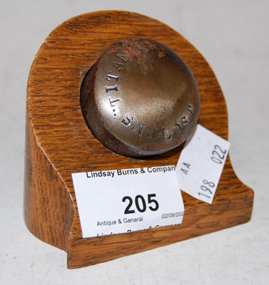 Lot 205 - Titanic interest: a metal souvenir/ rivet?...