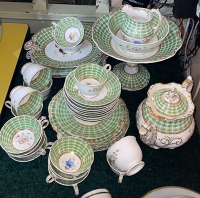Lot 380 - A 19th century green ground tea service, with...