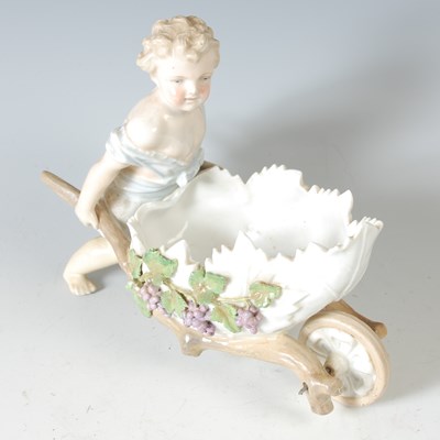 Lot 308 - An early 20th century porcelain garden cherub...