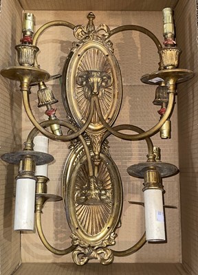 Lot 516 - Four 20th century gilt metal wall sconces, the...