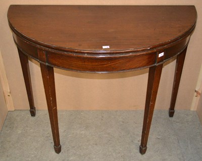 Lot 745 - A George III mahogany demi lune card / games...