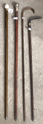 Lot 503 - A collection of four sticks, to include a...