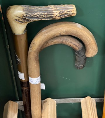 Lot 499 - A group of three walking sticks, to include an...