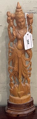 Lot 366 - An Indian carved wooden figure of Lakshmi,...