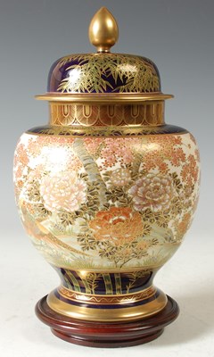 Lot 183 - A Japanese Satsuma pottery jar and cover by...