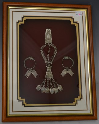 Lot 606 - A Middle Eastern Omani silvered pendant...