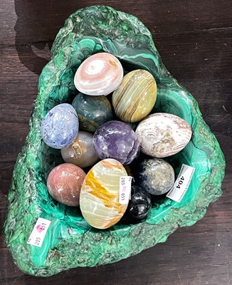 Lot 404 - A heavy malachite bowl containing a group of...
